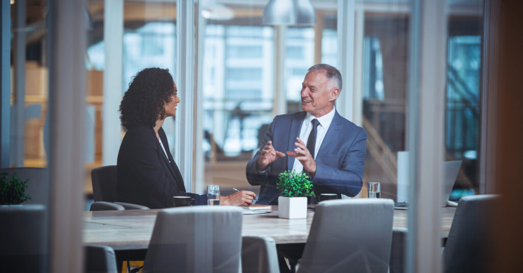 Business interview between a male and female professional.