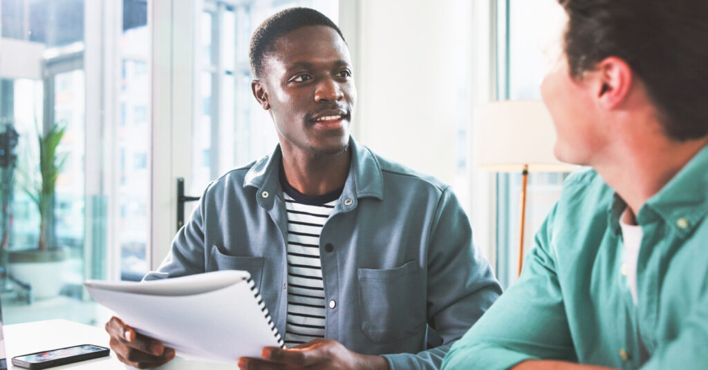 Man discussing papers